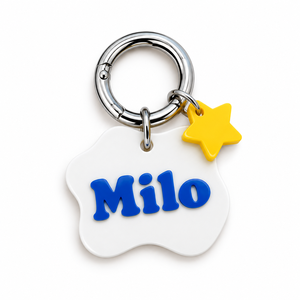 White CharmPup acrylic pet tag with a yellow star charm